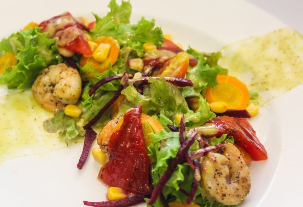 Close-up of a sea food meal served on a table in Alexander's Restaurant at Courtleigh Hotel and Suites