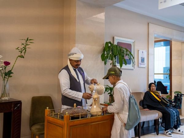 Staff pours tea in Saja by Warwick Makkah.