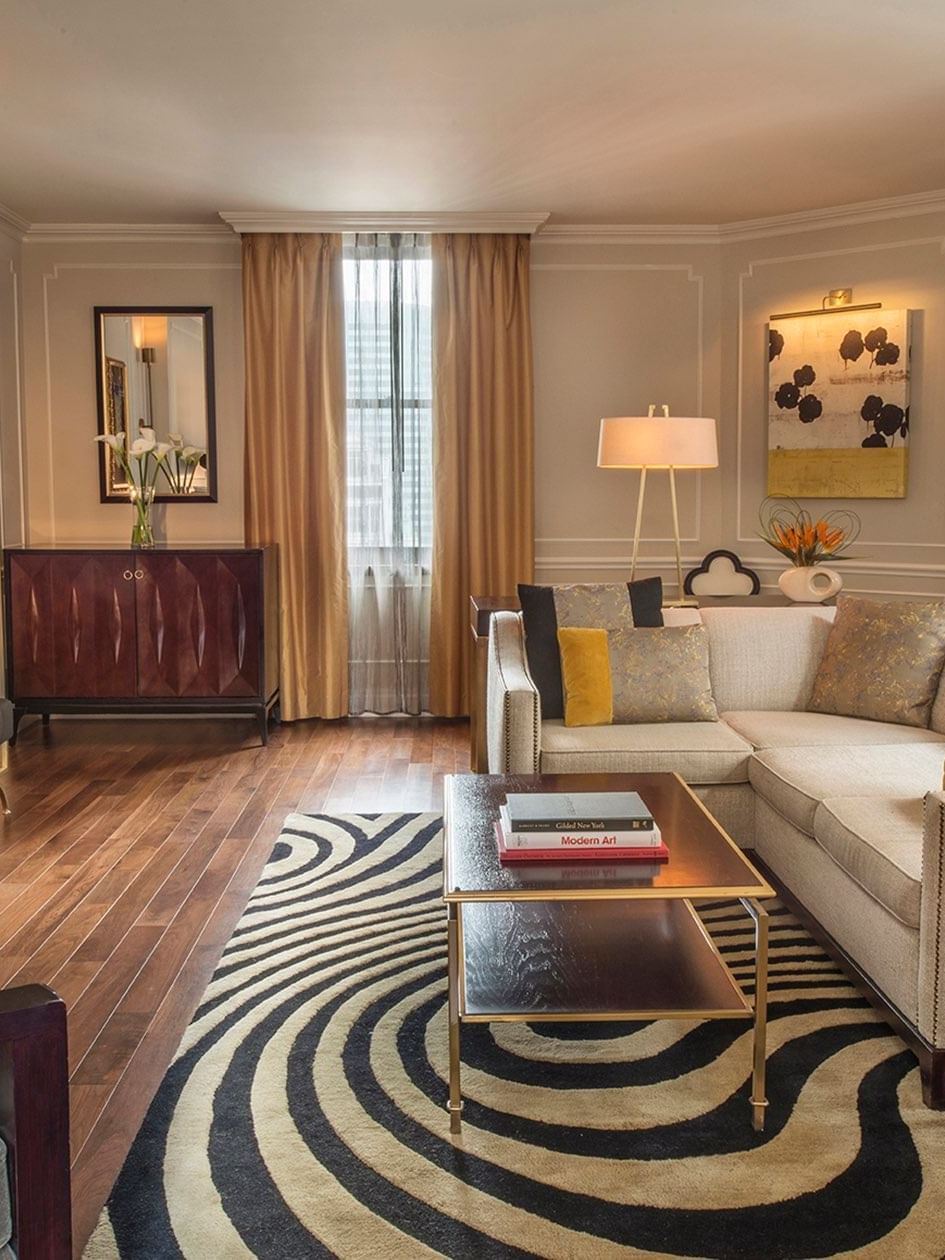 Jane Suite TV lounge with plush seating and a coffee table at Warwick New York