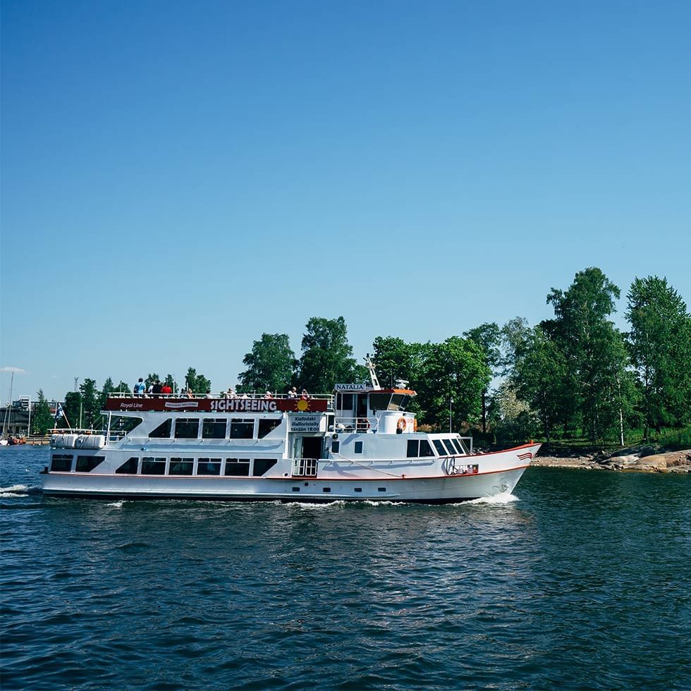 A boat sailing in the river near Falkensteiner Hotels