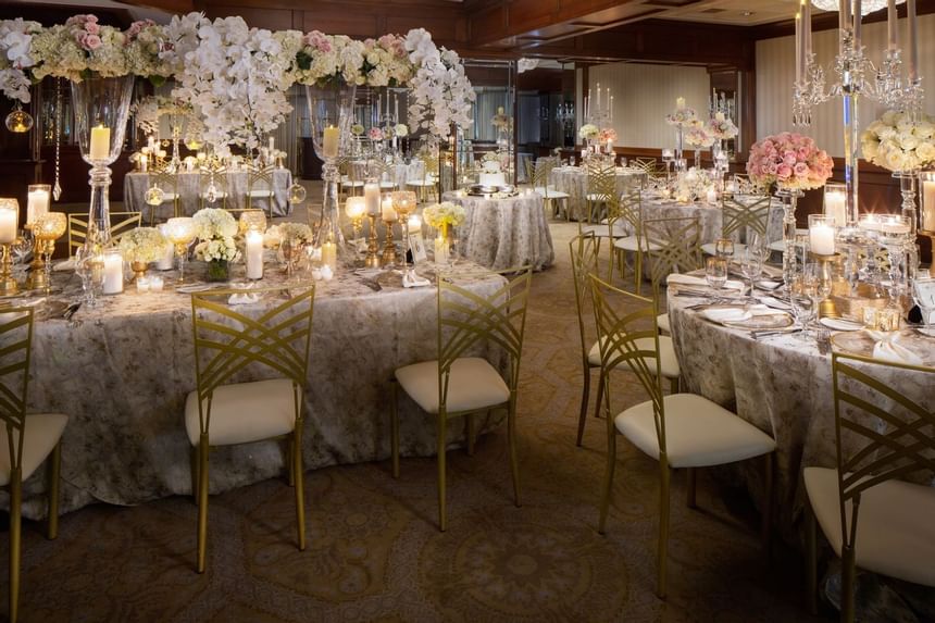 Decorated tables and chairs at a wedding in The Townsend Hotel