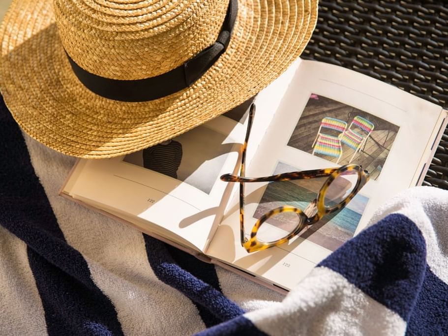 Reading by the pool at The Sebel Quay West Suites Sydney