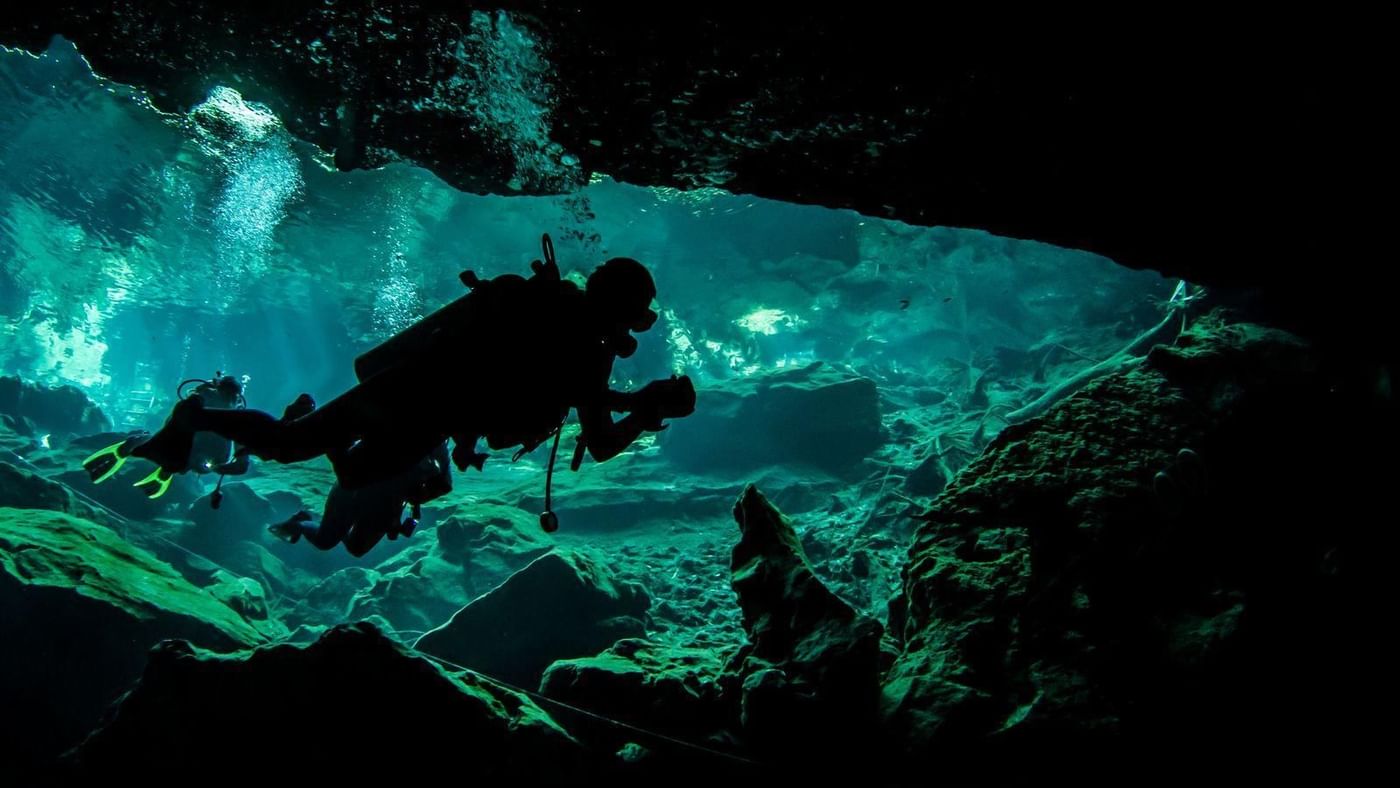 Diver in the deep sea near FA Hotels & Resorts