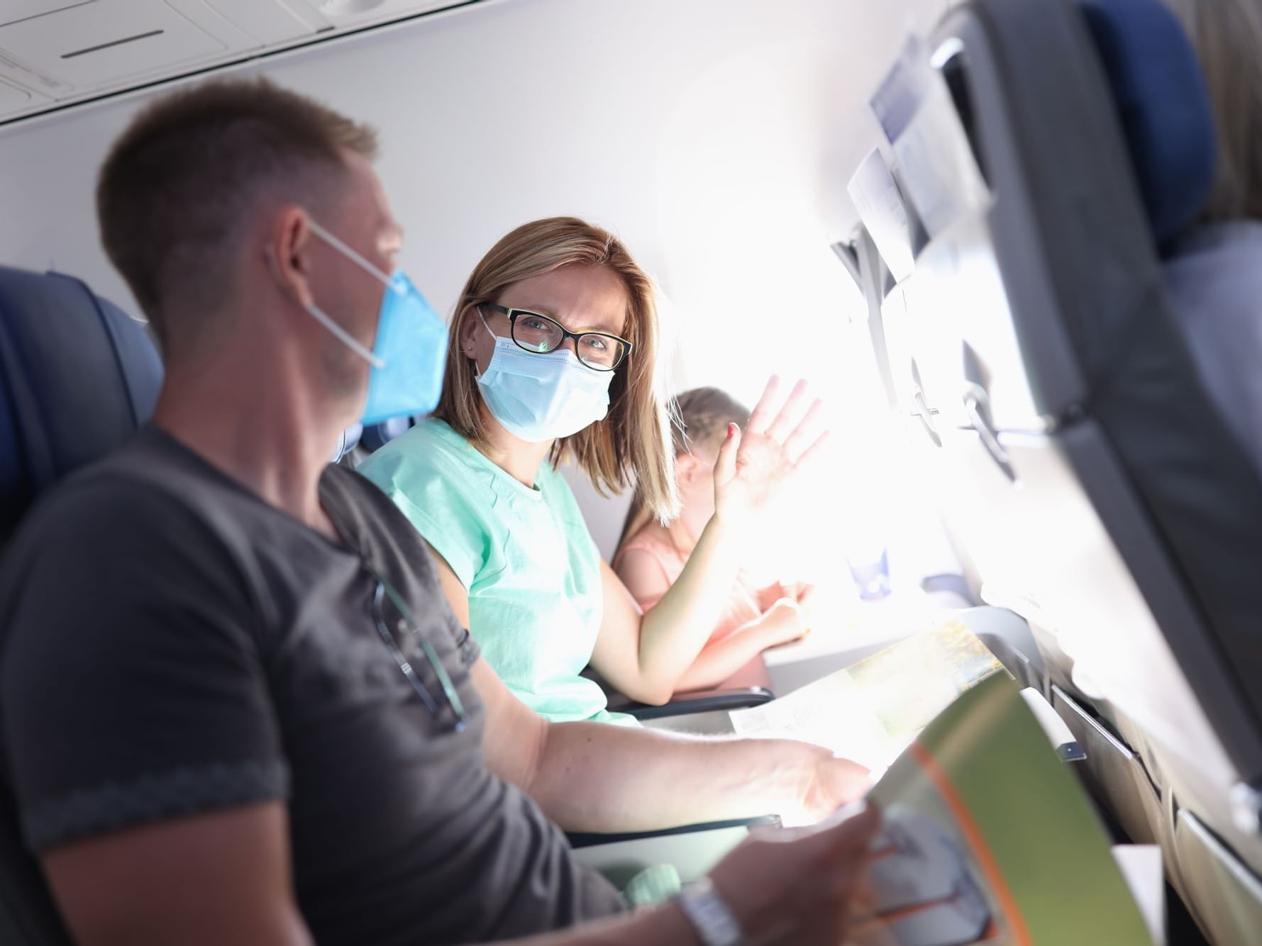 A couple with masks on flight to Daydream Island Resort