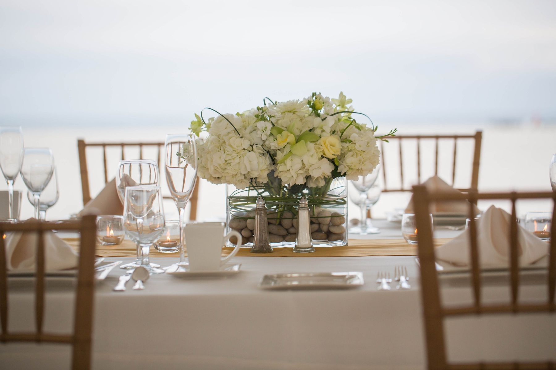 A table set with a flower centerpiece at our Cape May wedding venue