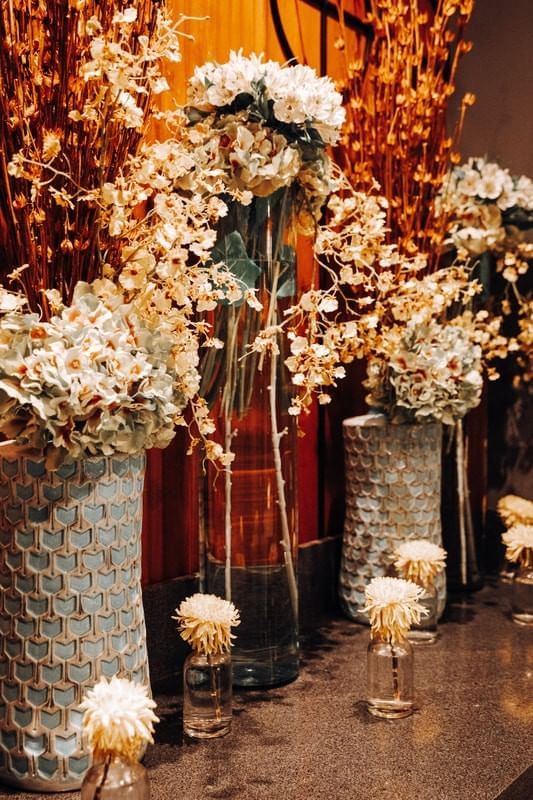 Vases with fresh flowers on a table at Casa Mali by Dominion