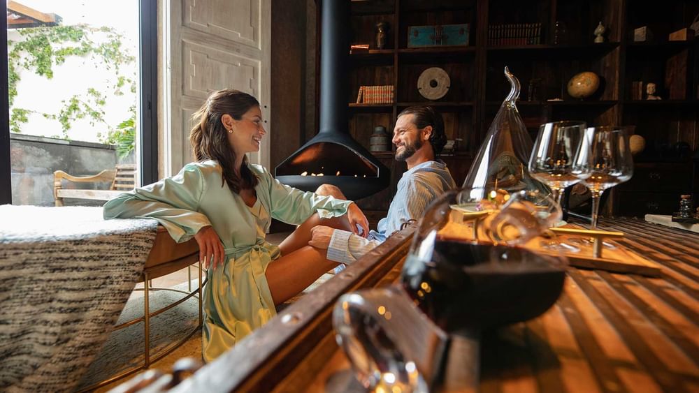 A couple relaxing in a cozy room at Live Aqua Resorts and Residence Club