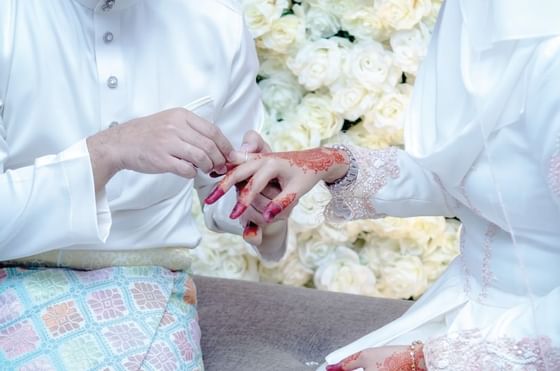 Groom holding bride's hand at The Federal Kuala Lumpur