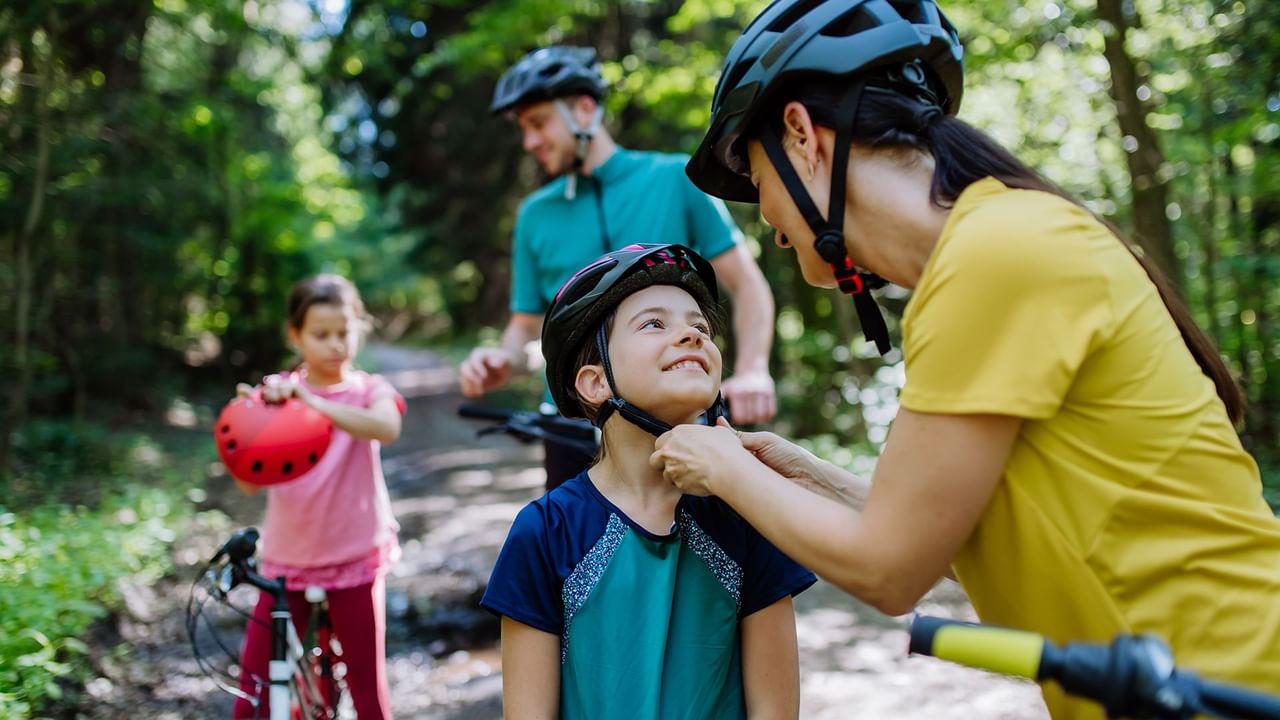 A family biking in the woods