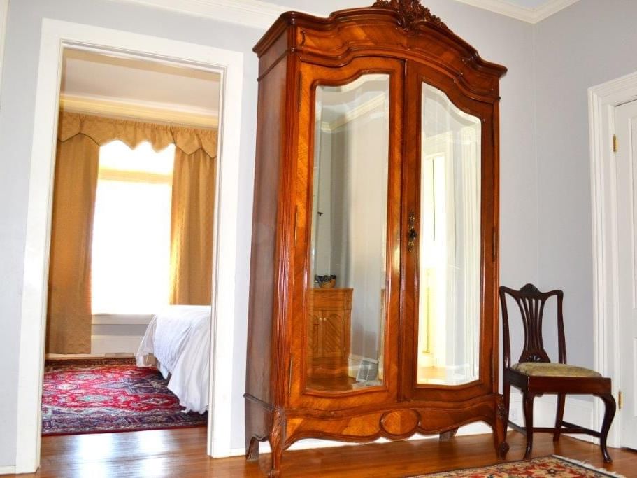 Interior of Brownell Cottage Suite bedroom at The Inn Saratoga