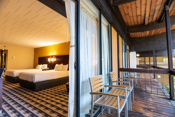 Balcony lounge area with wooden interior in Courtyard Queen Balcony at M Hotel Buffalo