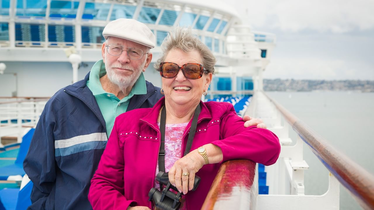 happy couple on a deck of cruise ship