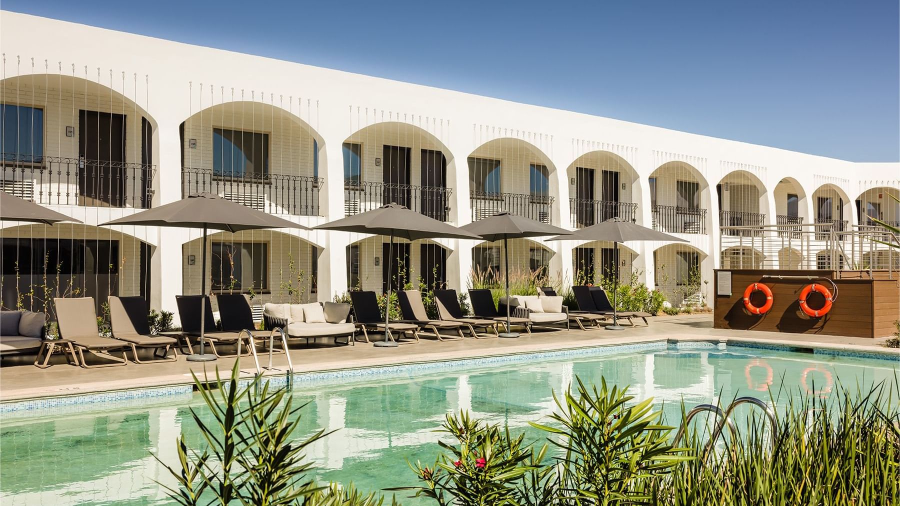 Sunbeds by the outdoor swimming pool at Gamma Ciudad Juarez