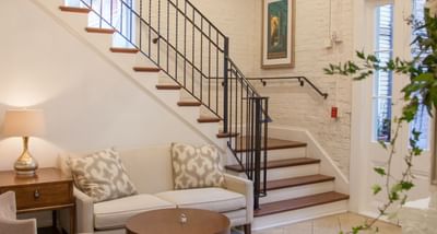 Loungers by the lobby's stairway at Hotel St. Pierre
