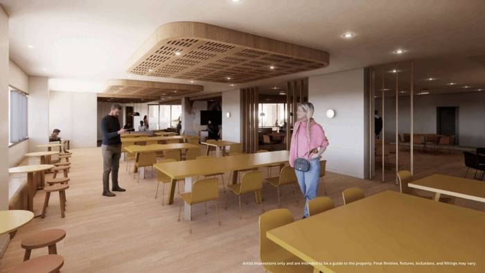 Modern communal dining area with wooden tables and chairs at UniLodge Brisbane City.
