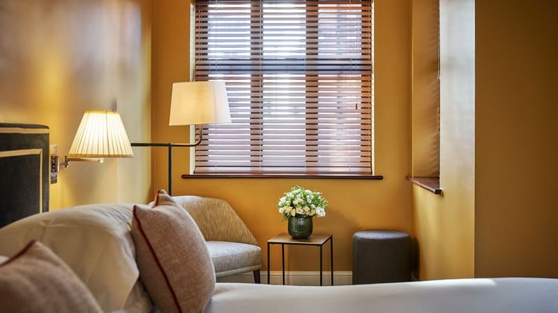 Interior of the One Bedroom Apartment with a flower vase at The Capital Hotel London