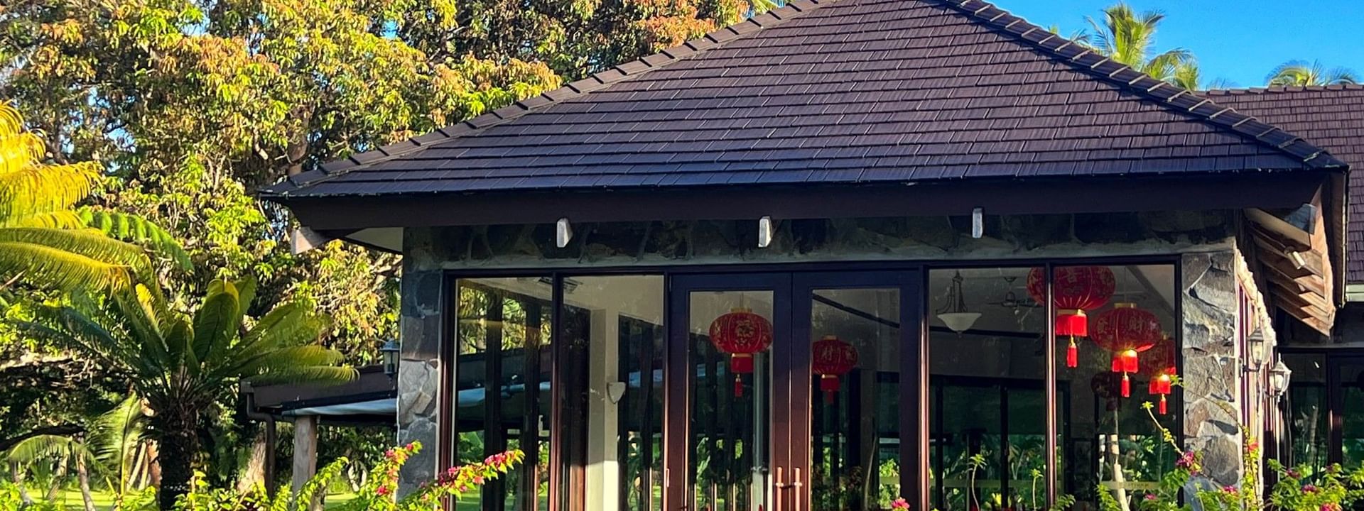 Bamboo Terrace restaurant with outdoor seating and lush greenery at The Naviti Resort in Korolevu