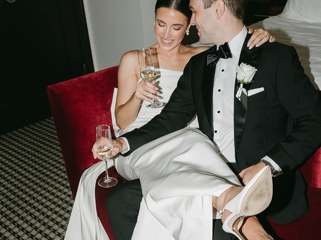 Close-up of bride & groom with wines at The Mayo Hotel