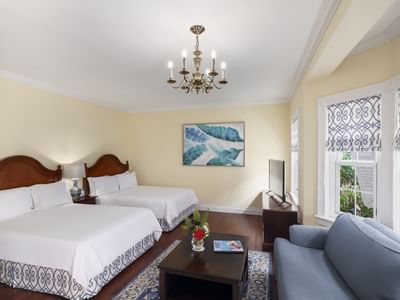 Deluxe Mini Suite with cozy beds and a sofa at Royal Palms Hotel