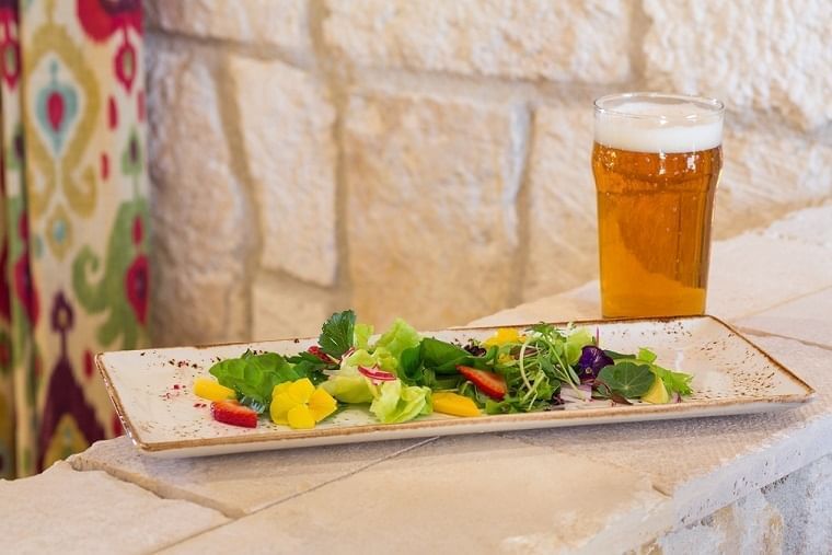 Lorem ipsum A salad accompanied by a cold beer at our Cello Restaurant