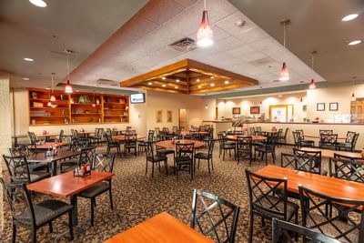 Dining tables arranged in Walden’s Restaurant at M Hotel Buffalo