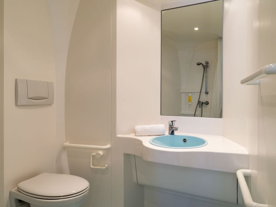 Bathroom vanity of bedrooms at Hotel Saint-Flour