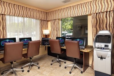Cafe area arranged with laptops at Crystal Inn Salt Lake City