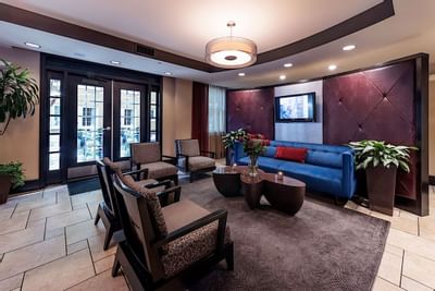 Comfy chairs in the lobby area at Artmore Hotel