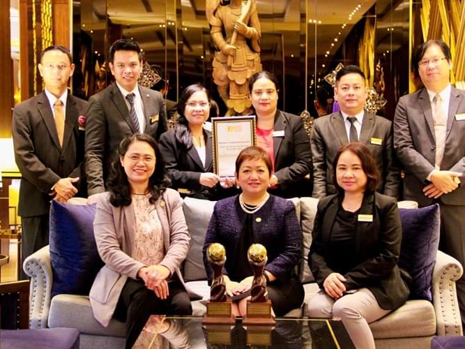 Staff posing in the lobby of Chatrium Royal Lake Yangon