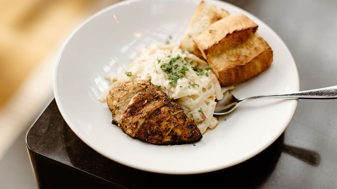 Chicken and pasta with garlic bread at Browns Socialhouse
