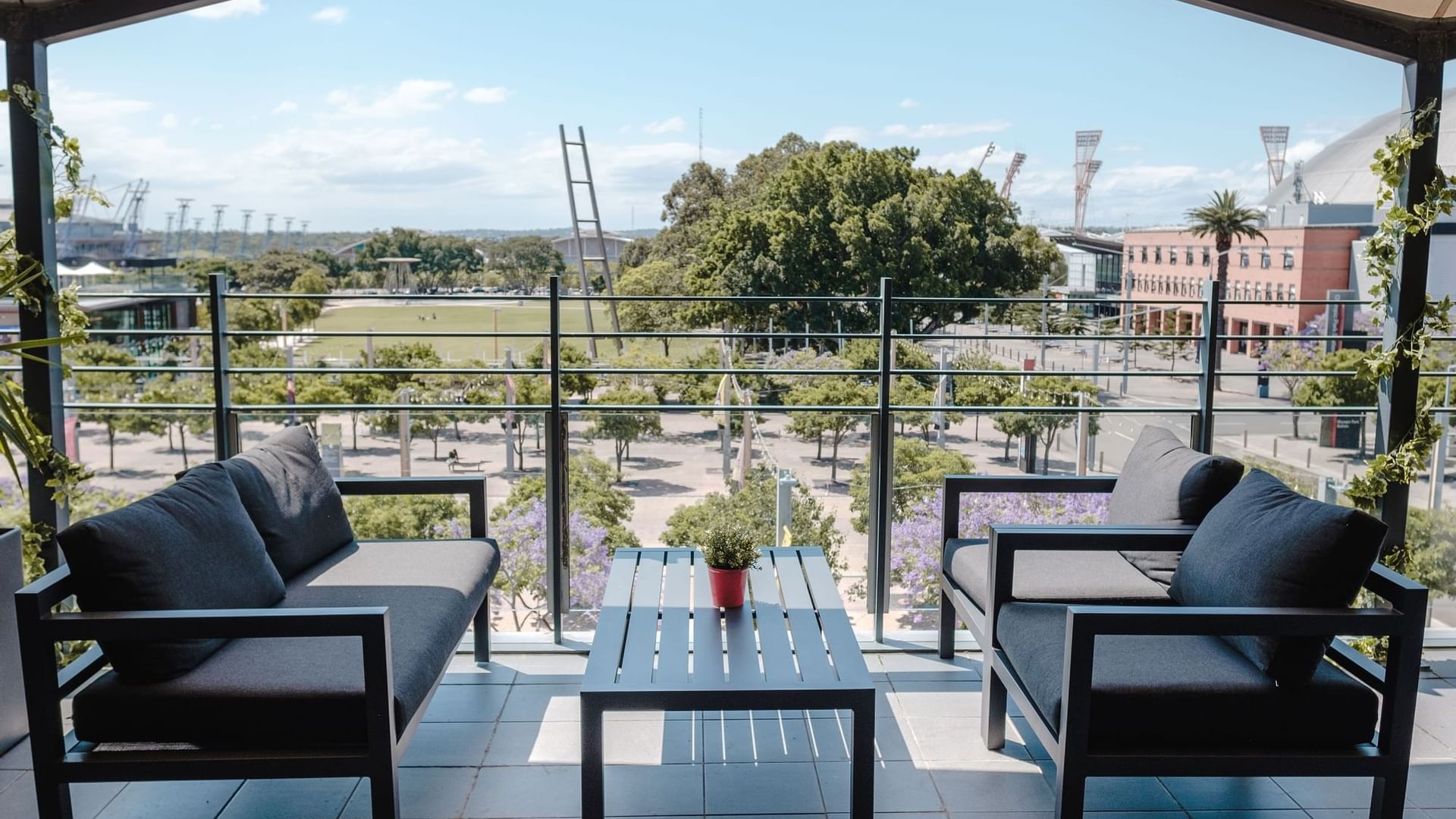 Balcony lounge area with a view at Novotel Sydney Olympic Park