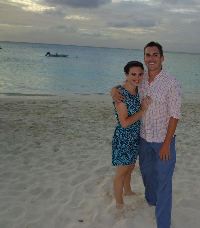 Couple taking snaps by the sea at The Somerset on Grace Bay