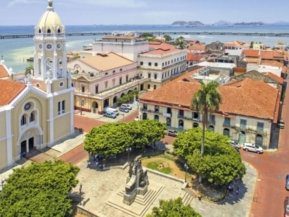 light colored buildings near water