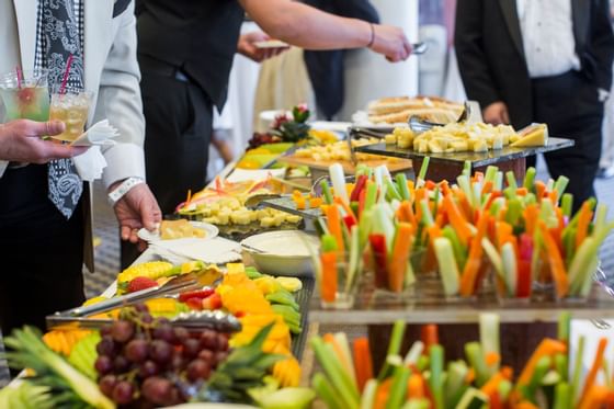 Close-up of people serving from the buffet at Honor’s Haven Retreat