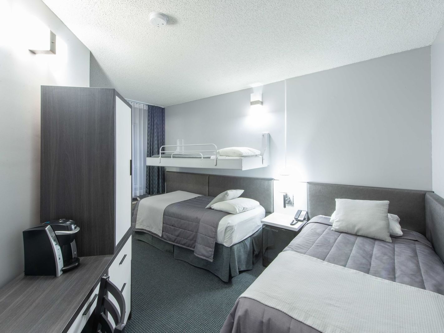 3 Beds, nightstand & cupboard Triple Room at Travelodge Montreal Centre