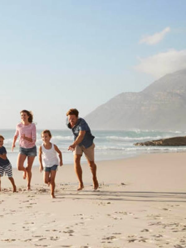 A family enjoying the sunny beach near Hotel Amiens Sud