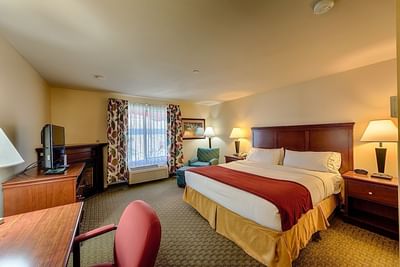 Bedroom in Fireplace Jacuzzi Suite at Triple Play Resort Hotel
