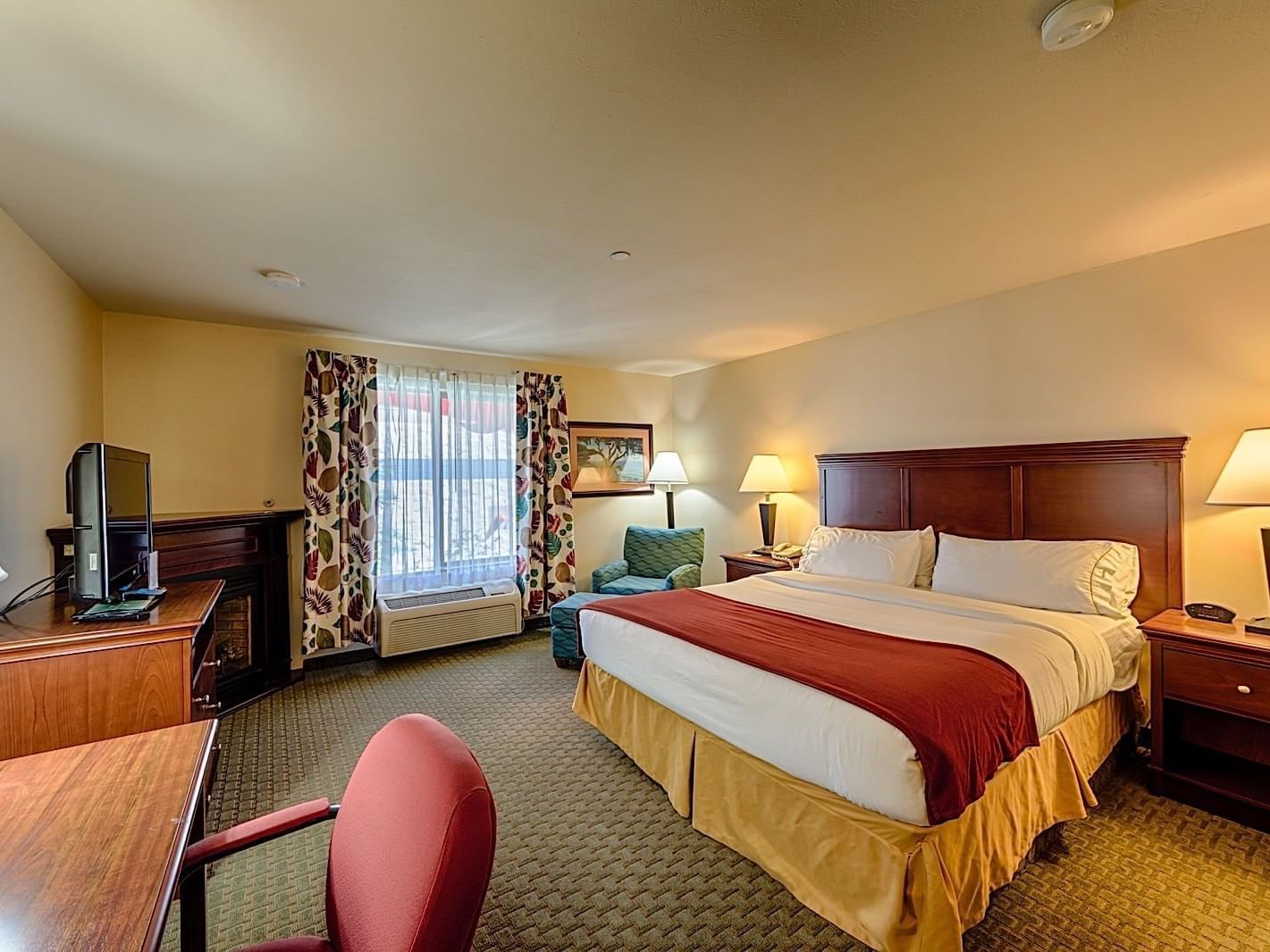 Bedroom in Fireplace Jacuzzi Suite at Triple Play Resort Hotel