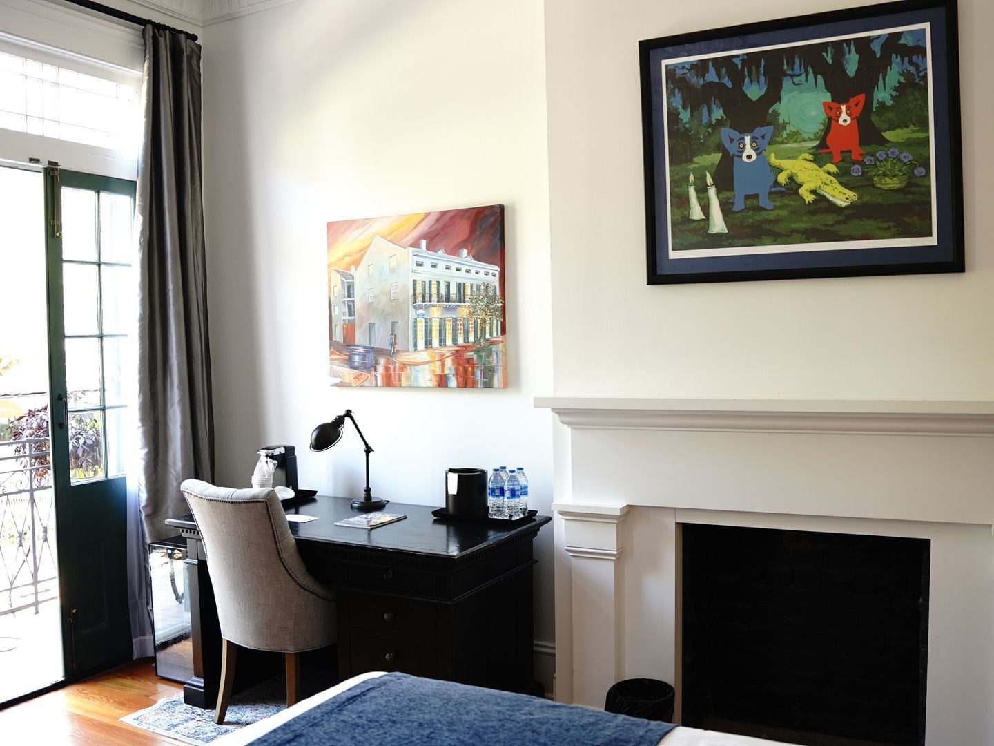Bedroom with a desk & fireplace at The Royal Frenchmen Hotel