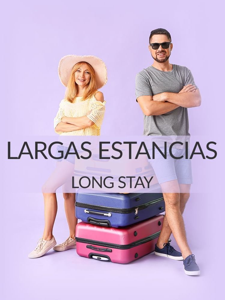 A couple with two three suitcases in a purple background in a long stay banner