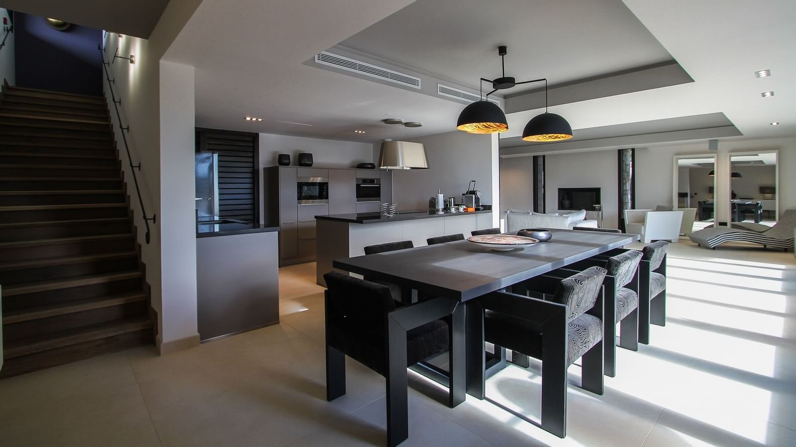 Dining table & kitchen in Prestige Suite, Domaine de Manville