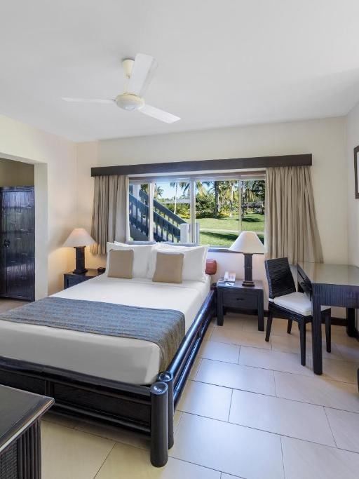 Lagoon View Room with a balcony, fan, and garden view at Warwick Le Lagon - Vanuatu in Efate.