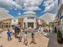 People in Tanger Outlet Mall near Harborside Hotel