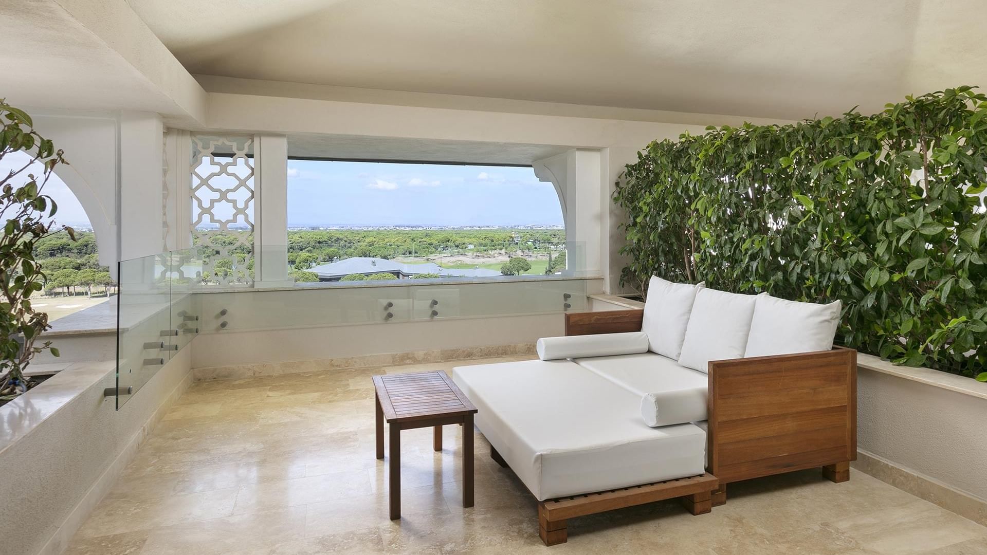 Terrace with a lounge sofa and table in Roof Superior Room at Cullinan Belek