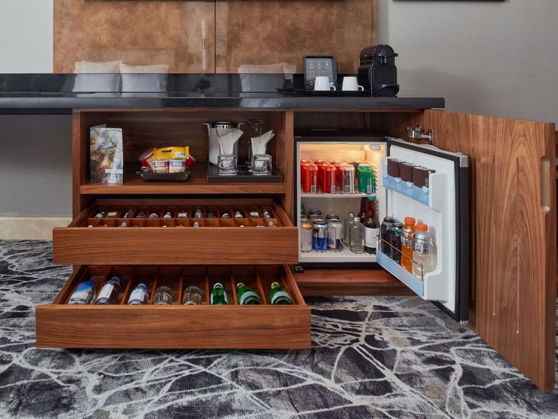 Mini fridge & bar in Deluxe King Room at Grand Fiesta Americana