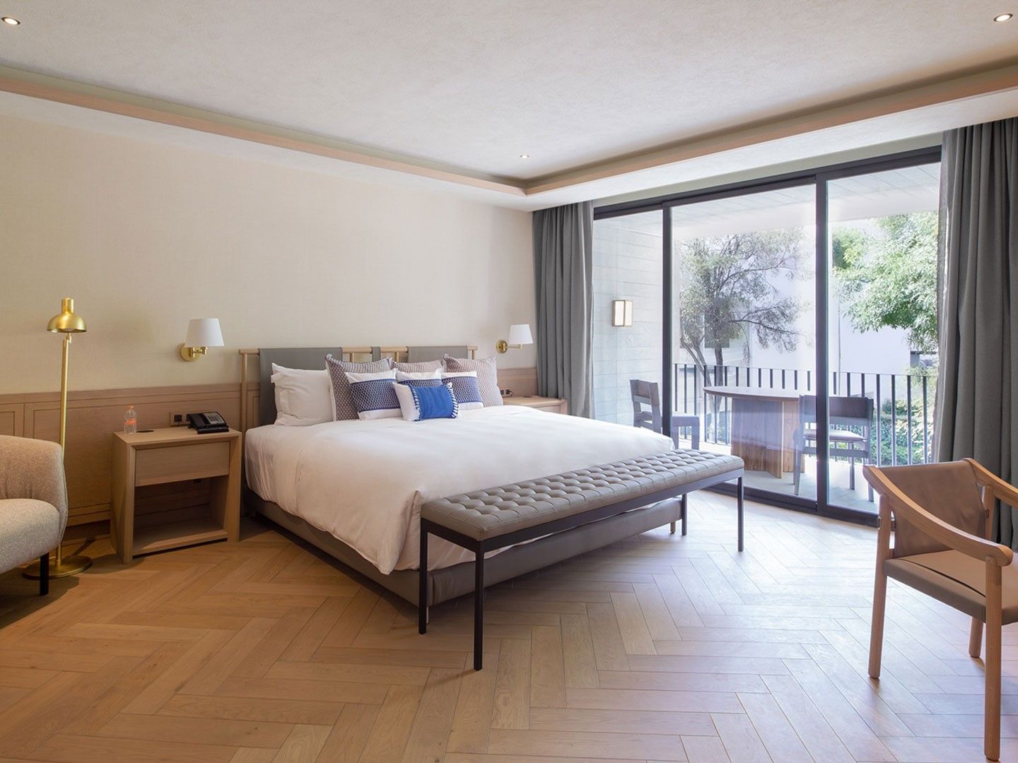 King Superior Viceroys Suite featuring a king bed, wood floors, and a scenic garden balcony at Camino Real Polanco Mexico