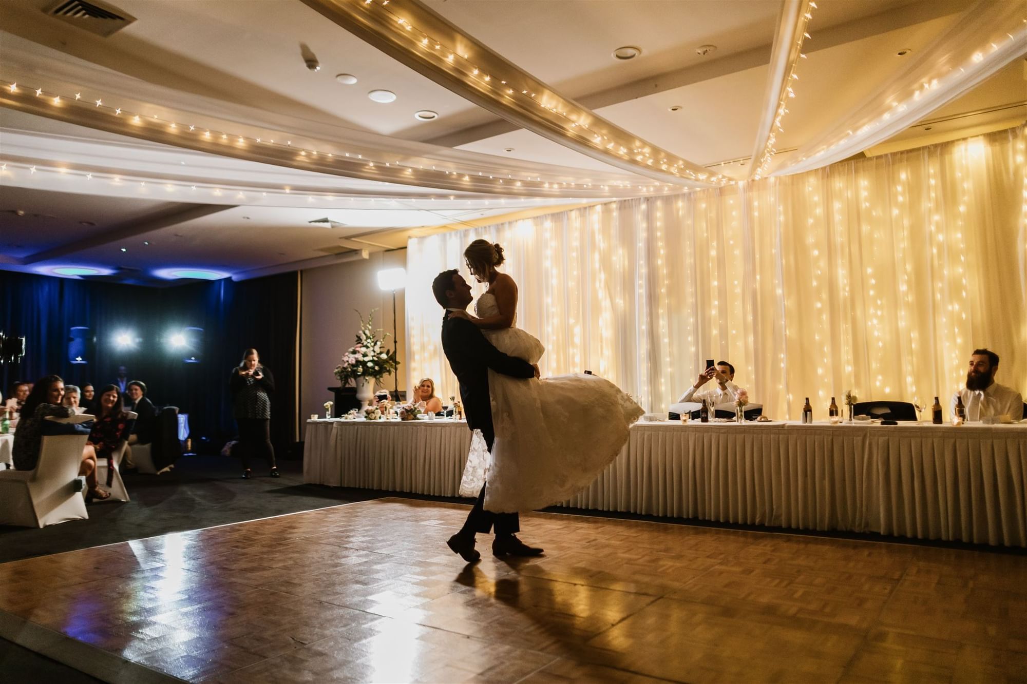 Bridal couple on dance floor for first dance