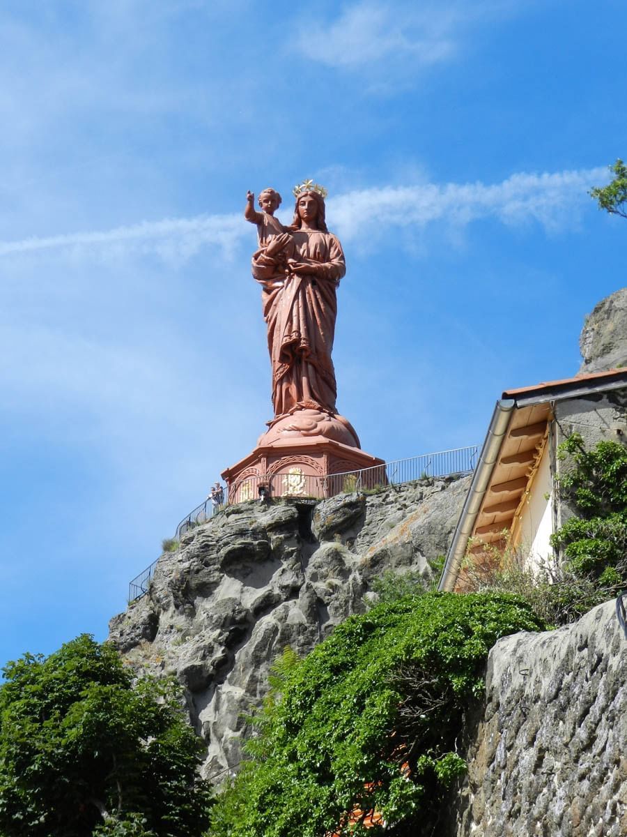 A sacred statue on top of a mountain