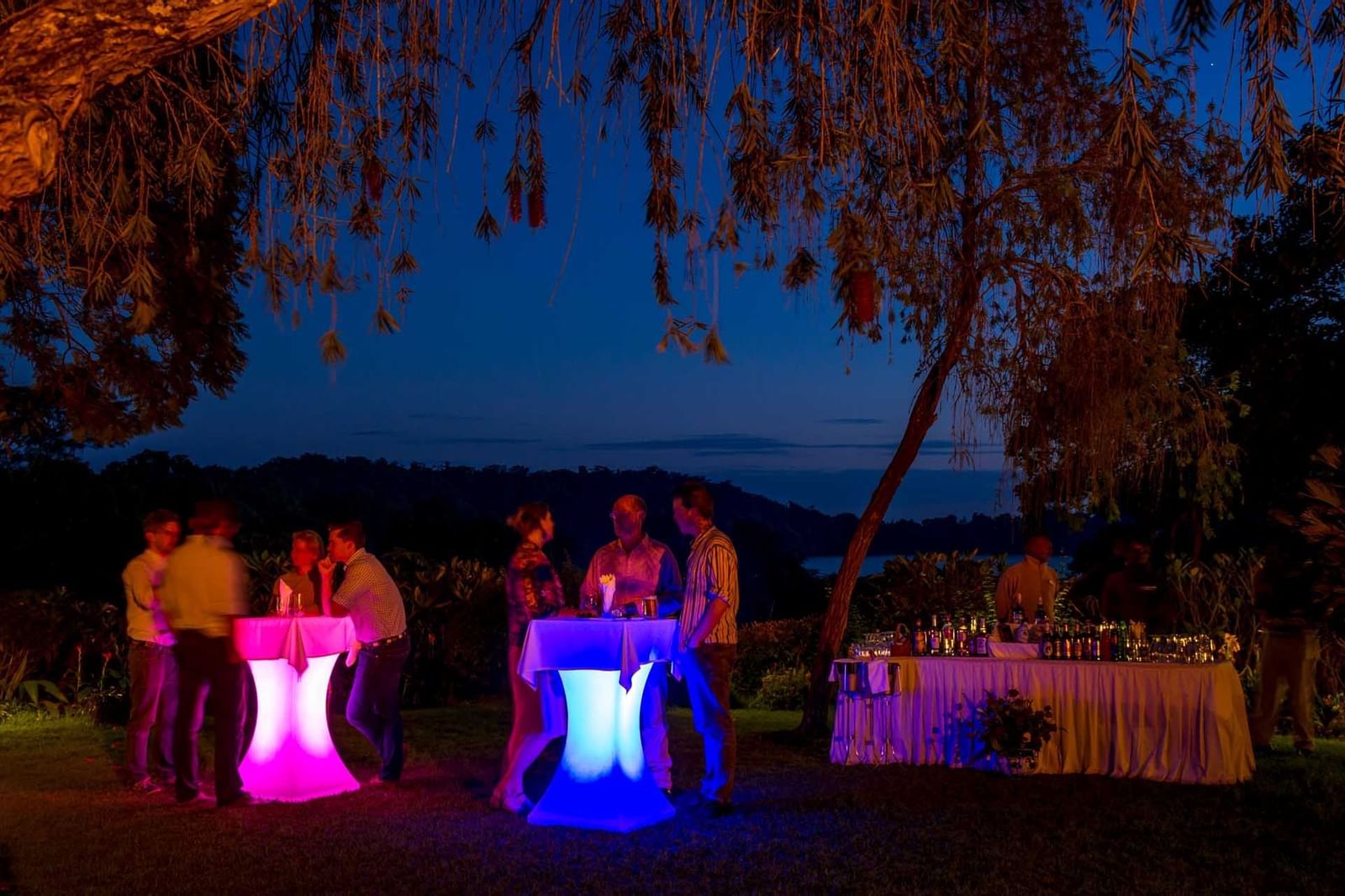 People having sundowners by the lake at Arusha Serena Hotels