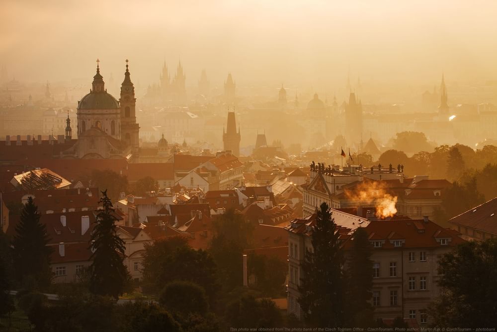 Aerial view of a Church and misty Prague City near Almanac X